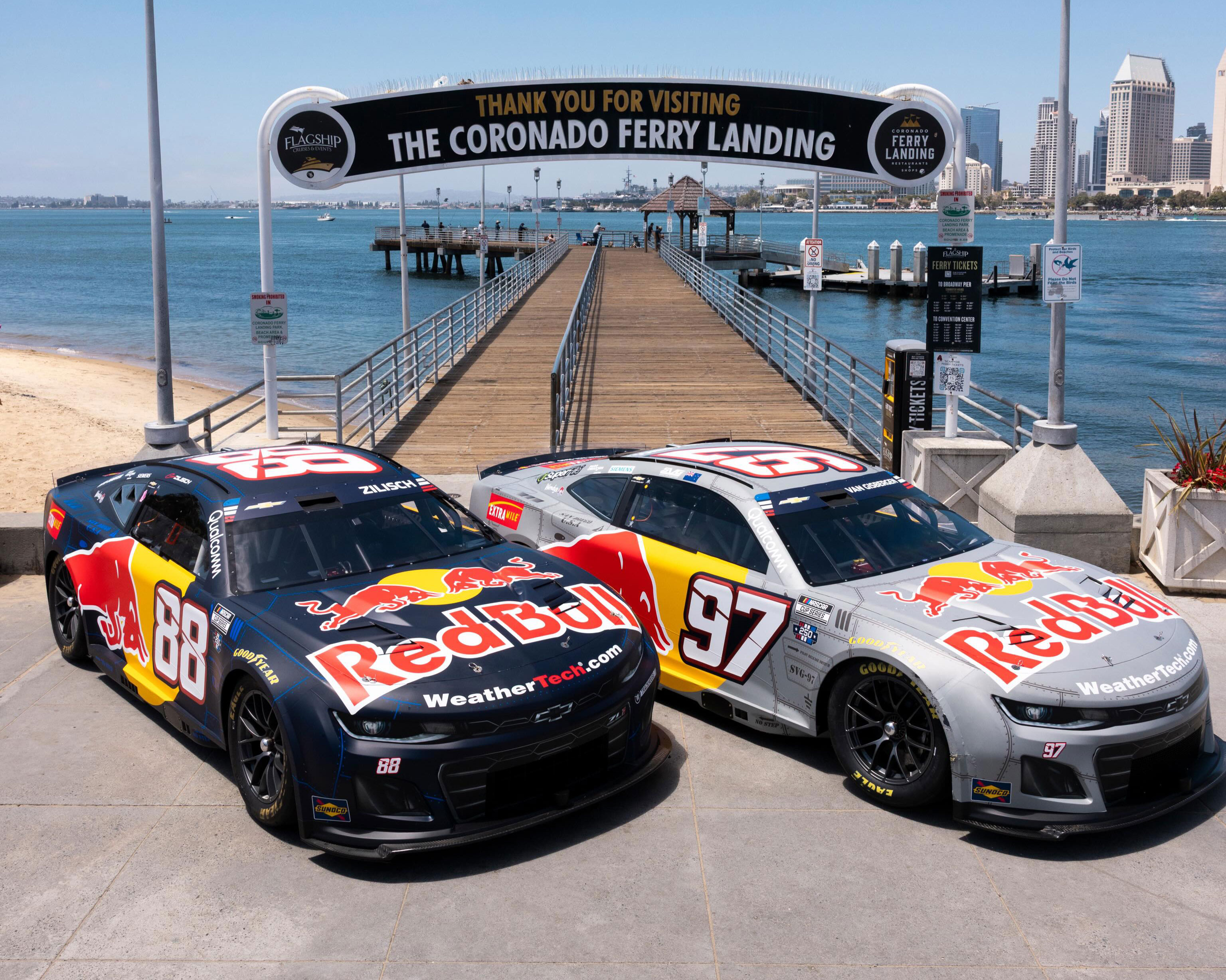 Two Red Bull race cars parked at the Coronado Ferry Landing