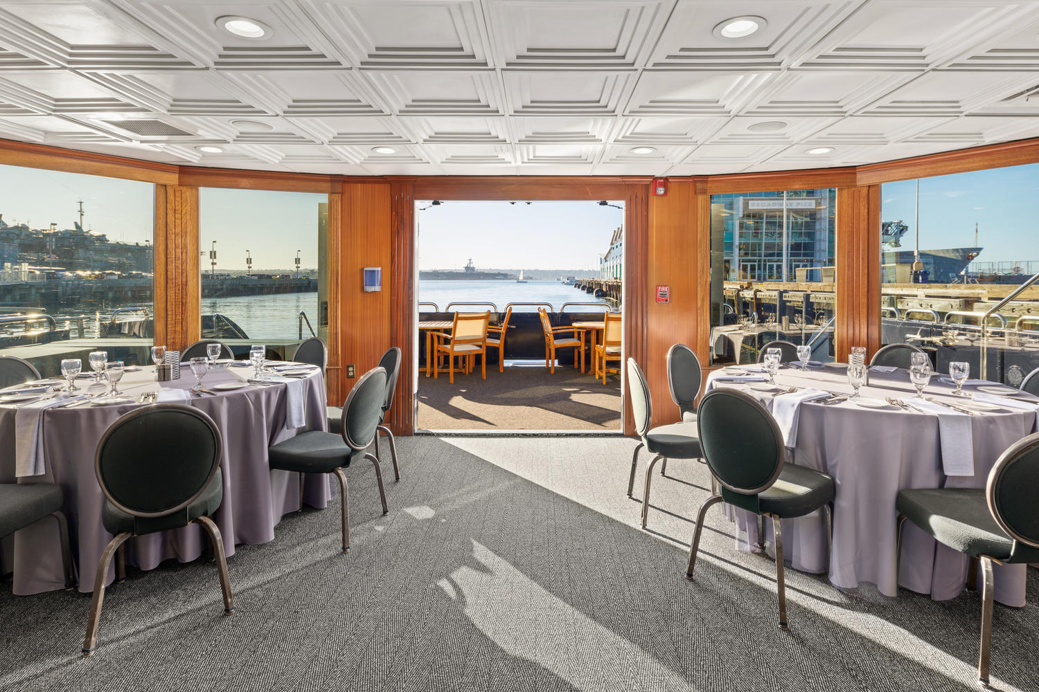 Main Deck – Aft View | Dining with waterfront views.