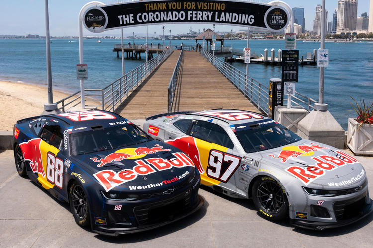 Two Red Bull race cars parked at the Coronado Ferry Landing