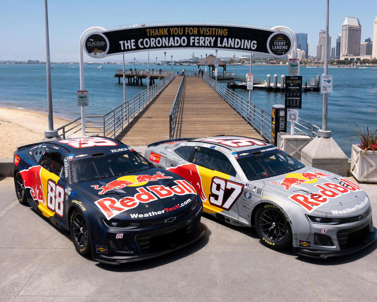 Two Red Bull race cars parked at the Coronado Ferry Landing